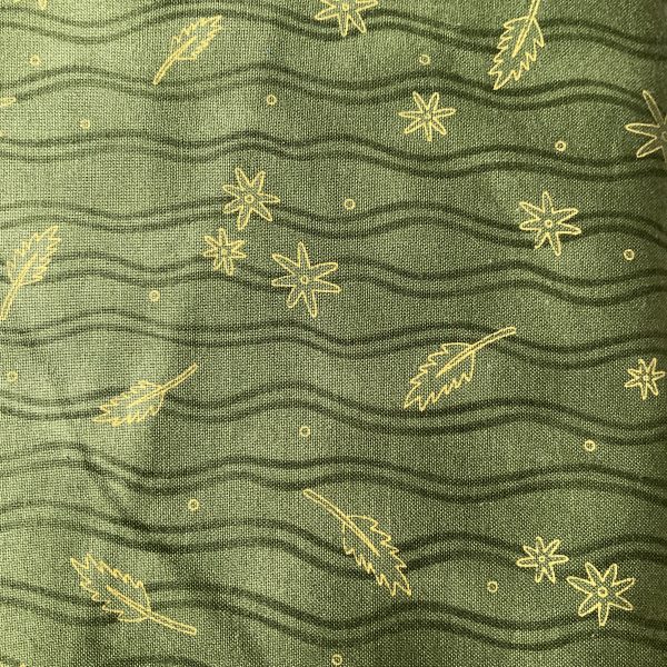 Tessuto verde con stampa di piccole foglie in oro